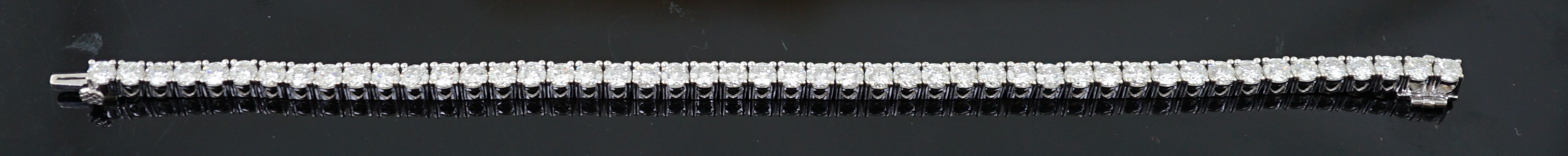 An 18k white gold and diamond line bracelet